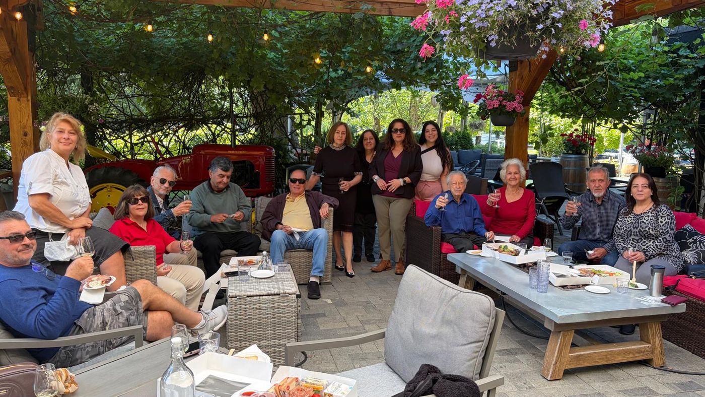 TCA Vancouver members raising their glasses together on the patio at Country Vines Winery