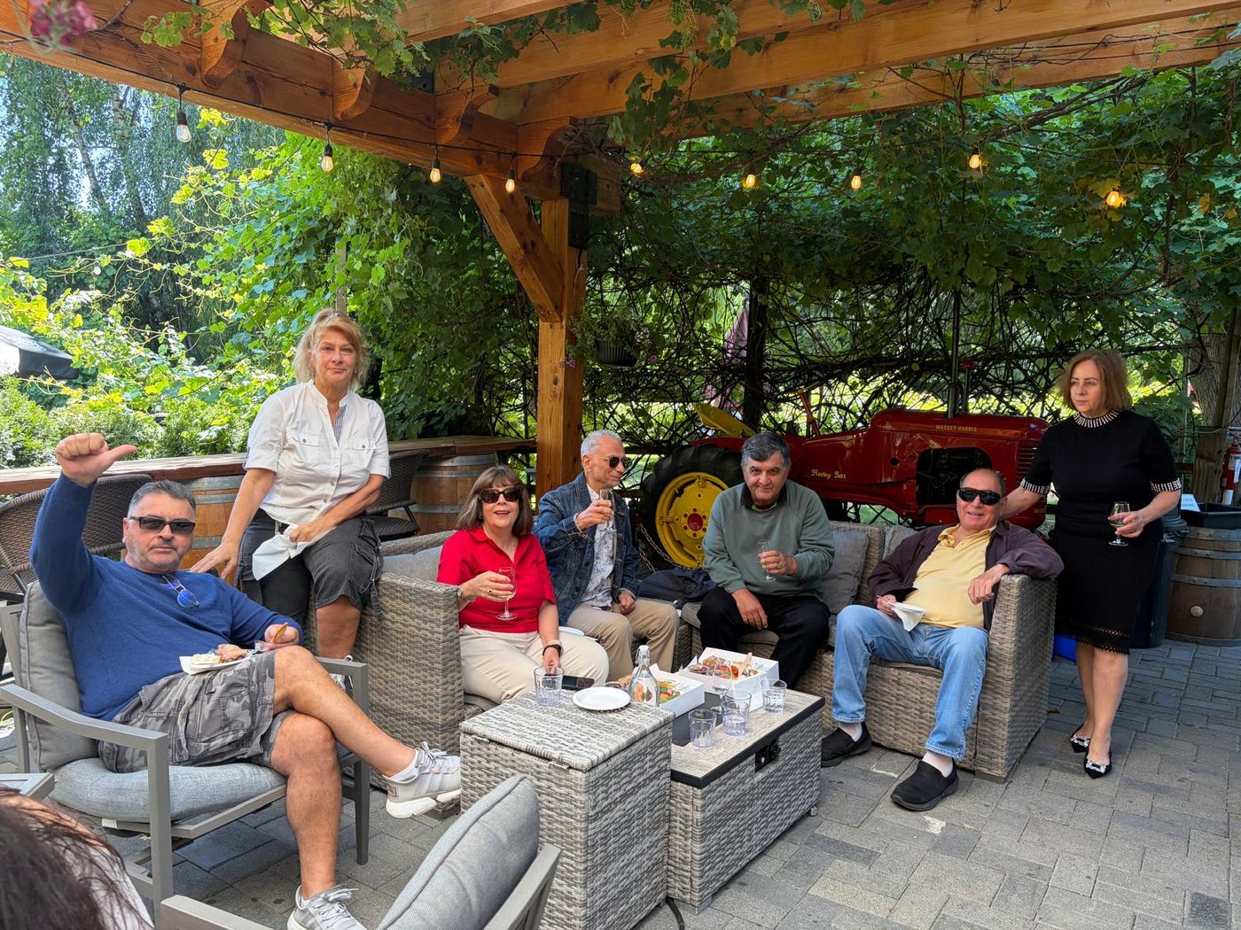 Members relaxing together under the pergola at Country Vines